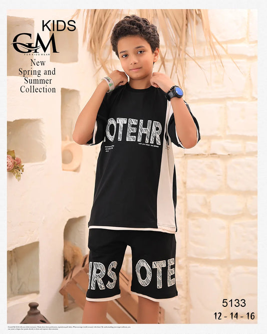 Child wearing a black outfit with 'GOTEIGO' branding in a decorative setting.