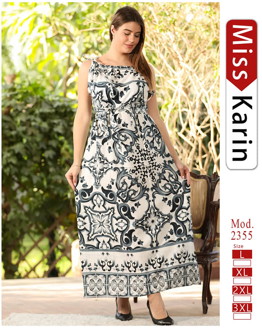 Woman wearing a patterned dress sitting outdoors with 'Miss Karin' branding.