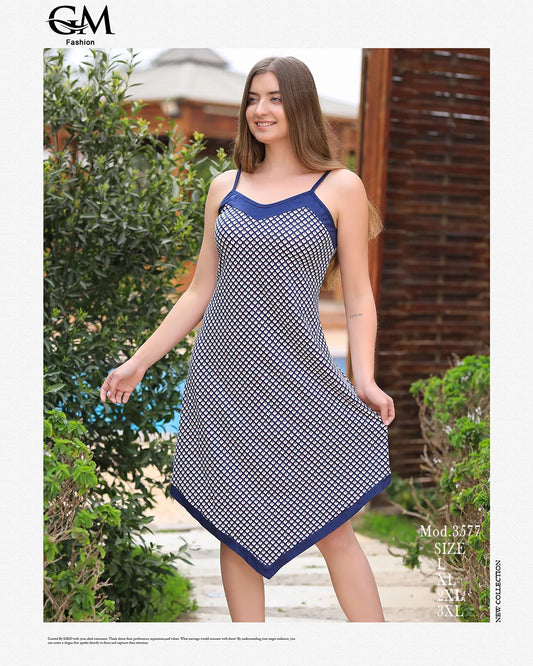 Woman wearing a blue and white patterned dress outdoors with 'GM Fashion' branding.