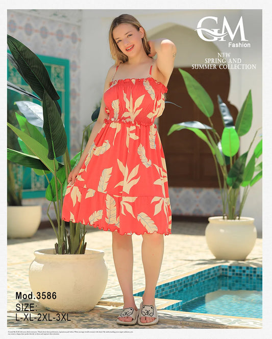Woman wearing a red floral dress by a pool with plants around