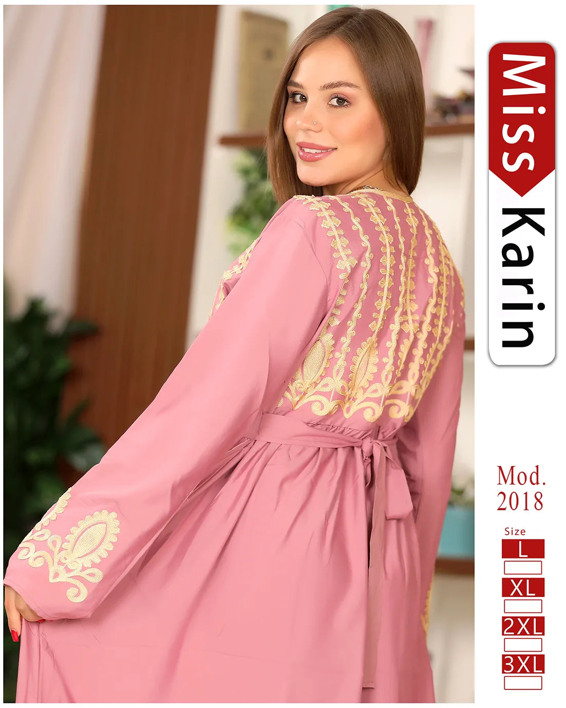 Woman wearing a pink dress with gold embroidery, brand 'Miss Karin' visible
