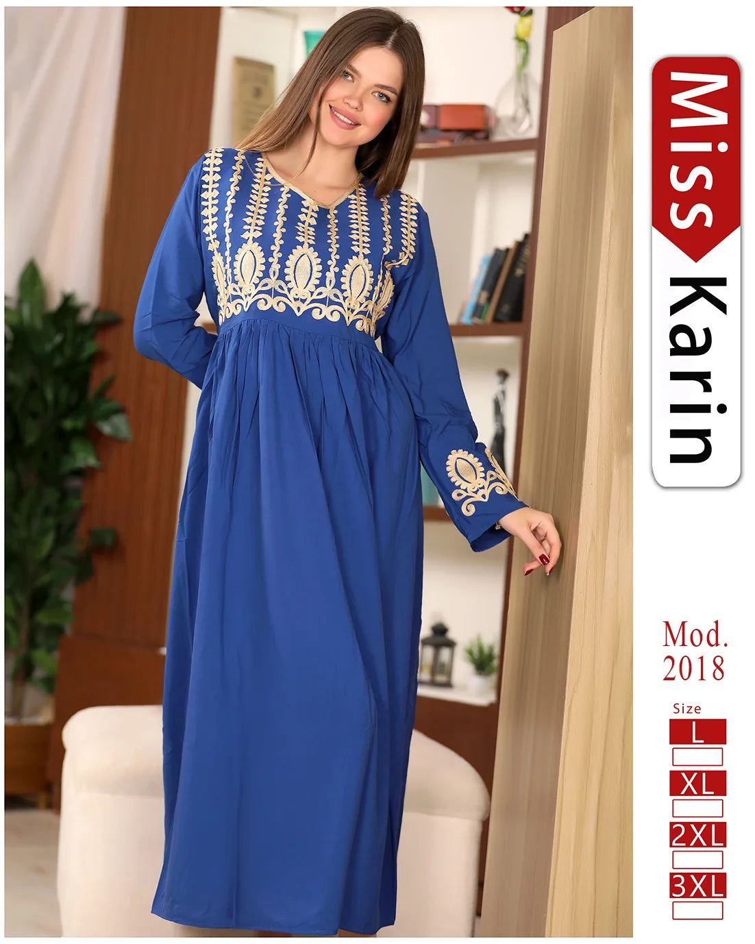 Woman wearing a blue dress with gold embroidery in a room setting, featuring 'Miss Karin' branding.