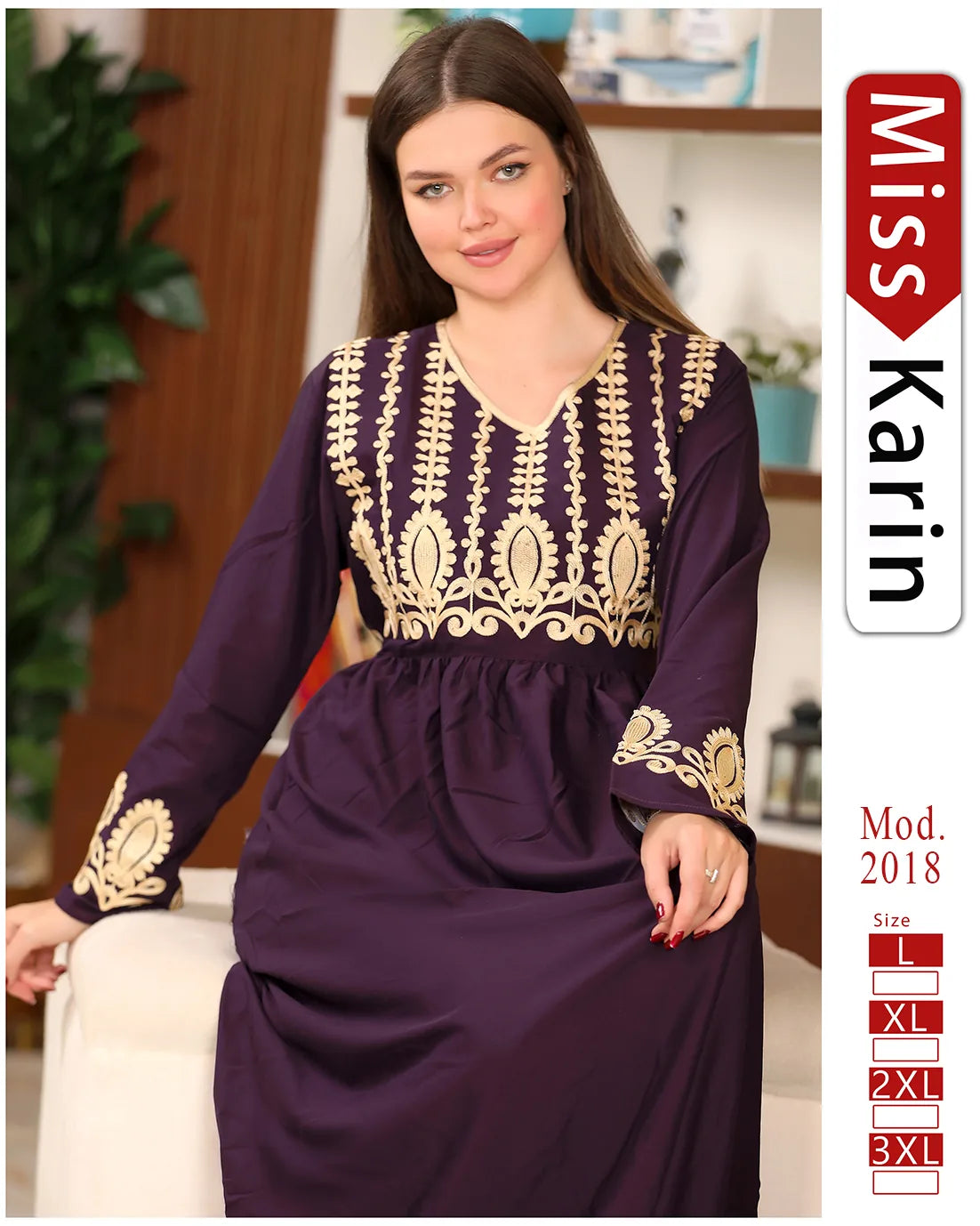 Woman wearing a purple dress with gold embroidery, sitting on a couch indoors.