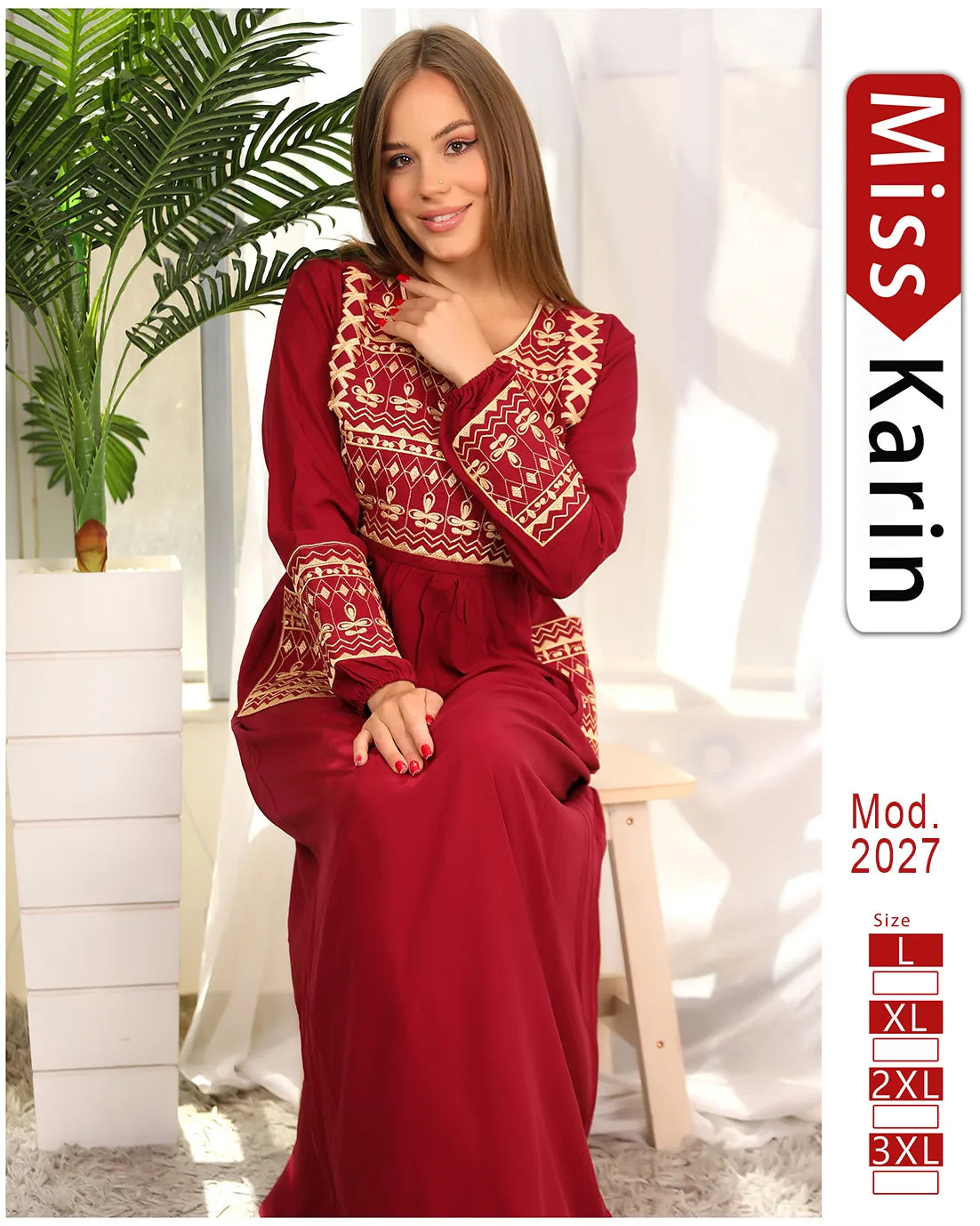 Woman wearing a red dress with intricate patterns, sitting indoors with a plant in the background, featuring the brand 'Miss Karin'.