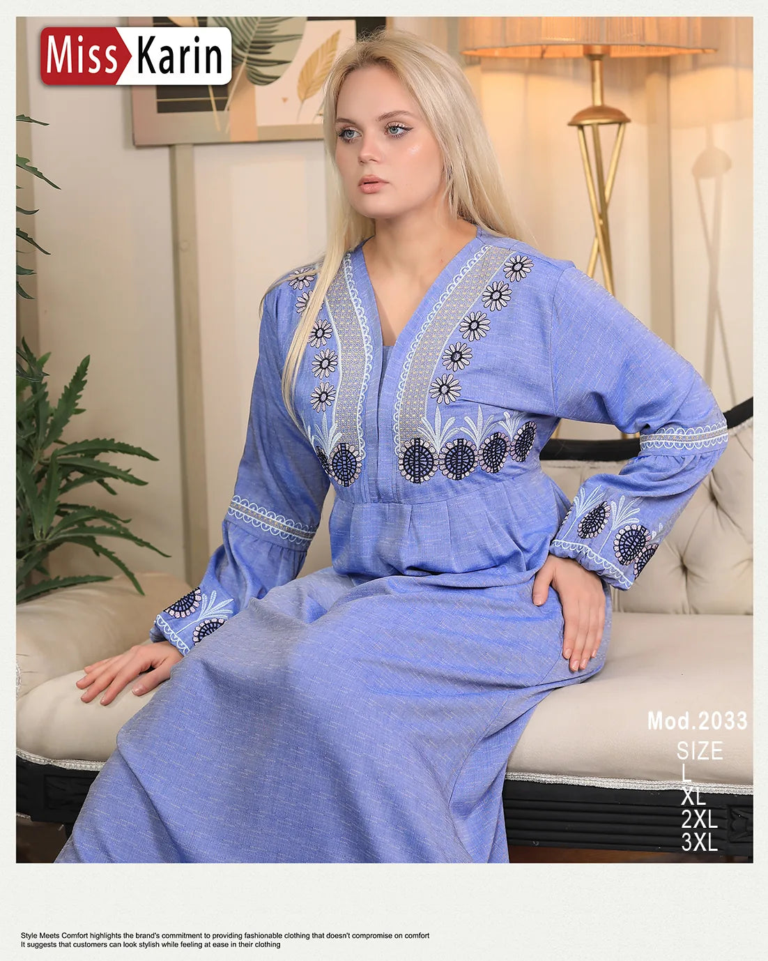 Woman wearing a blue embroidered dress sitting on a couch with 'Miss Karin' branding.