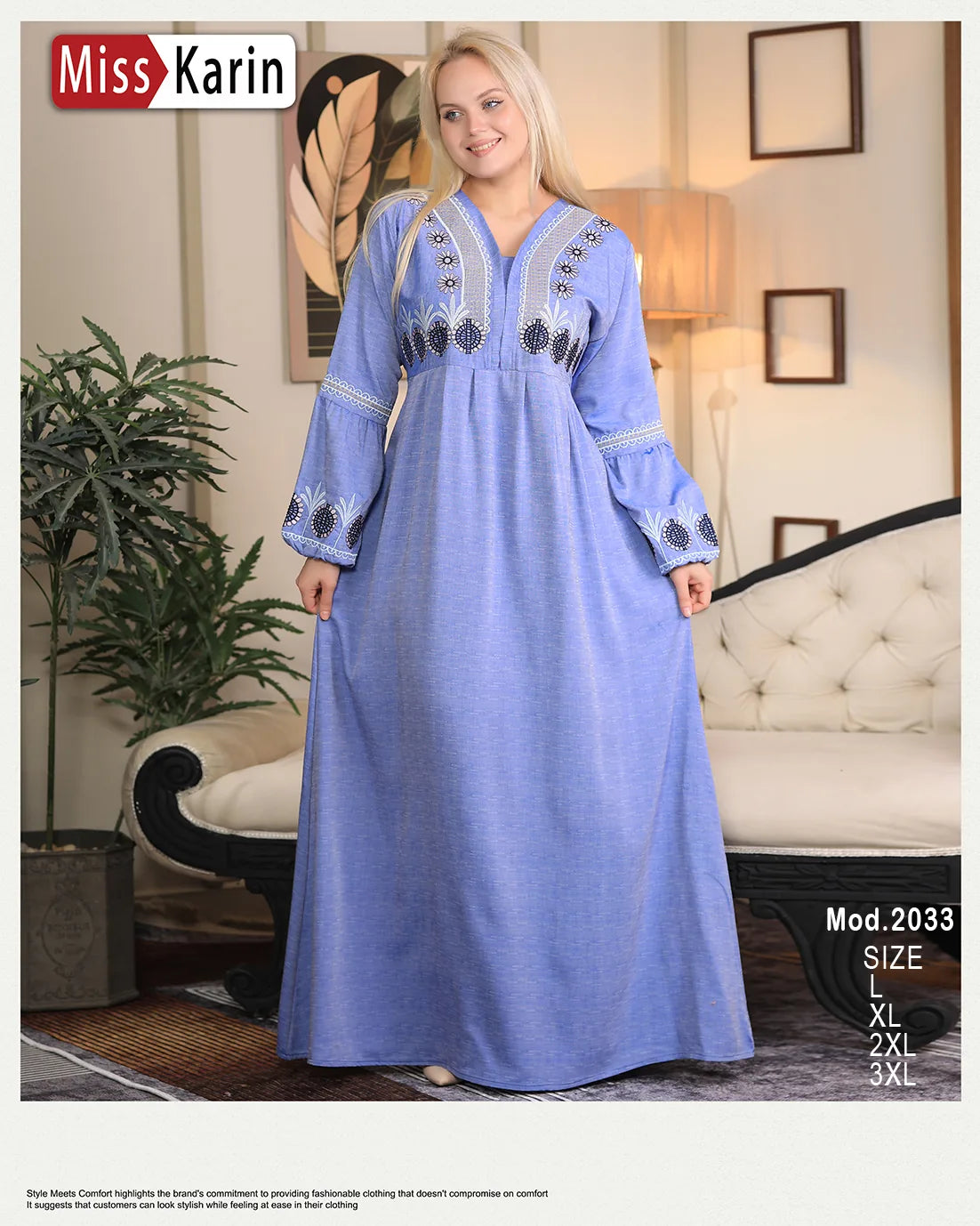Woman wearing a blue dress with embroidery in a room setting, featuring 'Miss Karin' branding.