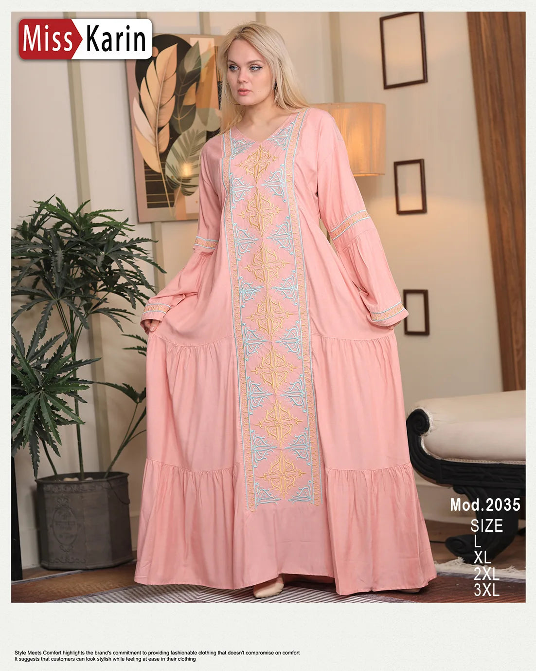 Woman wearing a pink dress with intricate patterns in a room setting, featuring 'Miss Karin' branding.