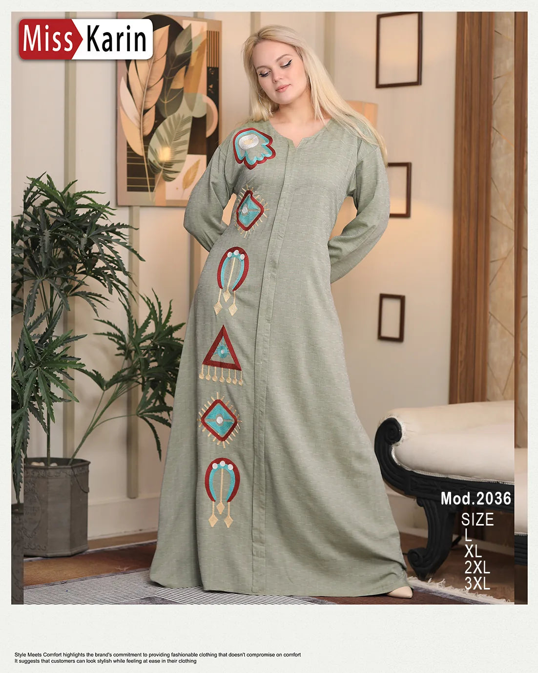 Woman wearing a long green dress with colorful patterns in a room setting.