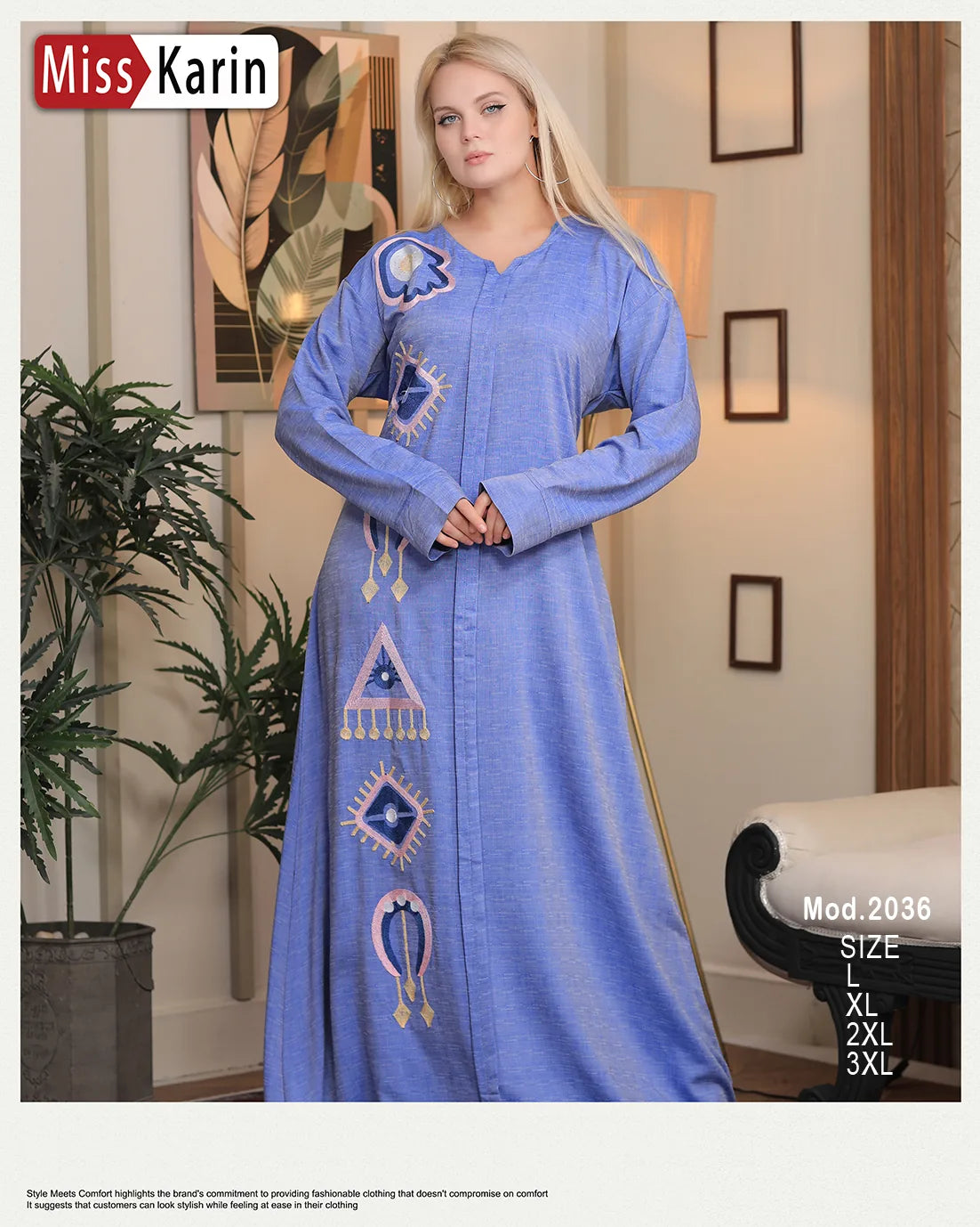 Woman wearing a blue dress with embroidery in a room setting, featuring 'Miss Karin' branding.