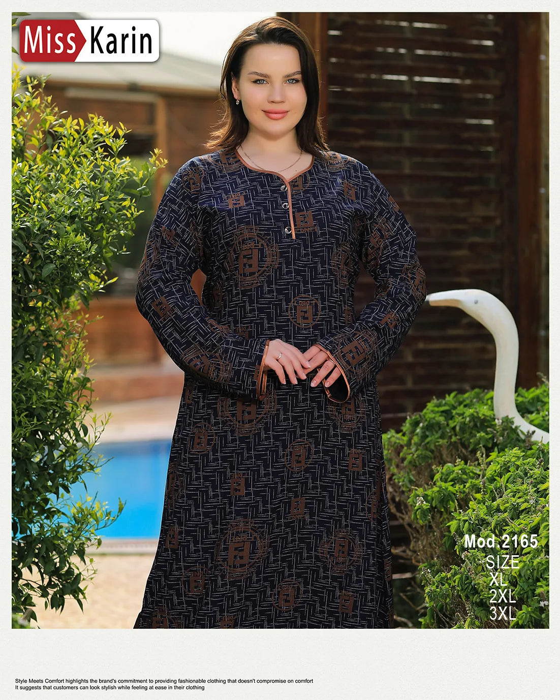 Woman wearing a long dark blue dress with patterns in an outdoor setting, with 'Miss Karin' branding.