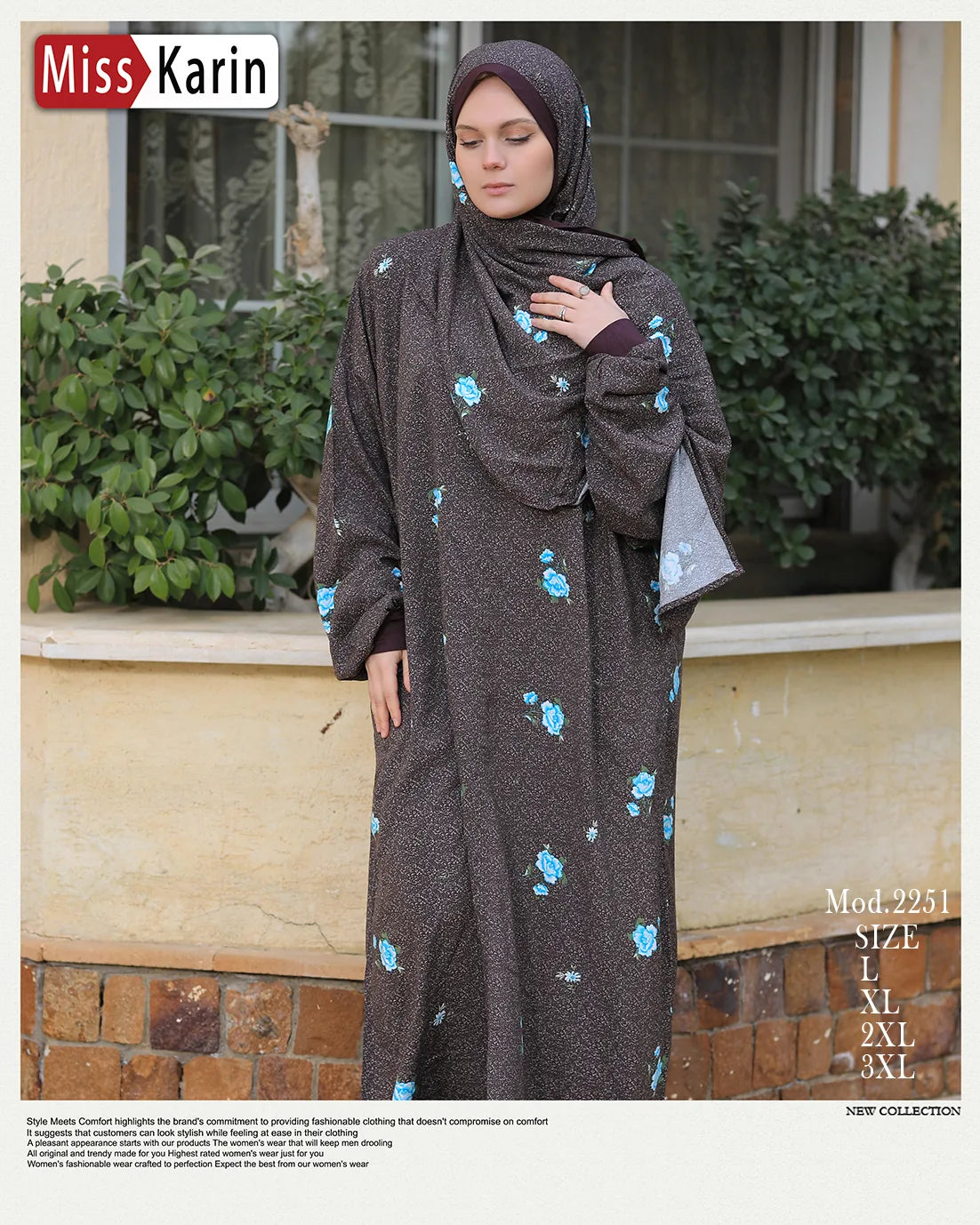 Woman wearing a long dark dress with floral patterns standing outdoors.