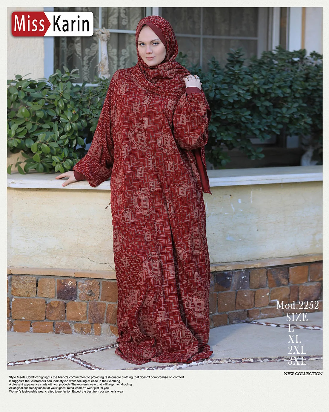 Woman wearing a red patterned dress and hijab standing outdoors with greenery in the background.