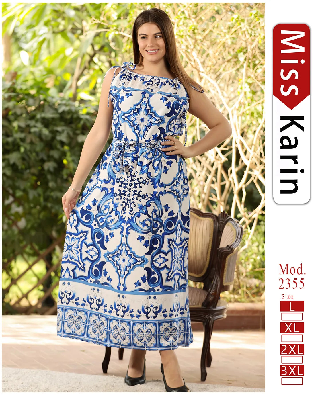 Woman wearing a blue and white patterned dress with 'Miss Karin' branding on the side.