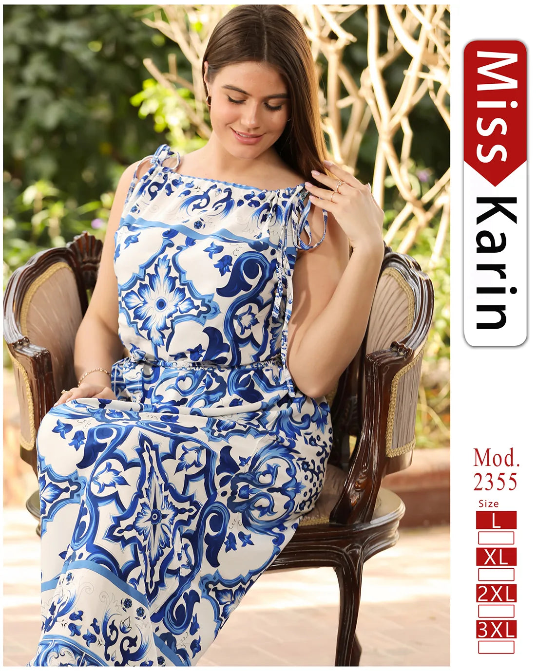 Woman wearing a blue and white patterned dress sitting on a chair with 'Miss Karin' branding.