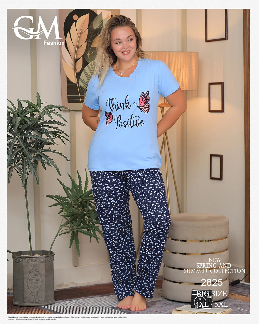 Woman wearing a light blue 'Think Positive' t-shirt and navy patterned pants in a home setting.
