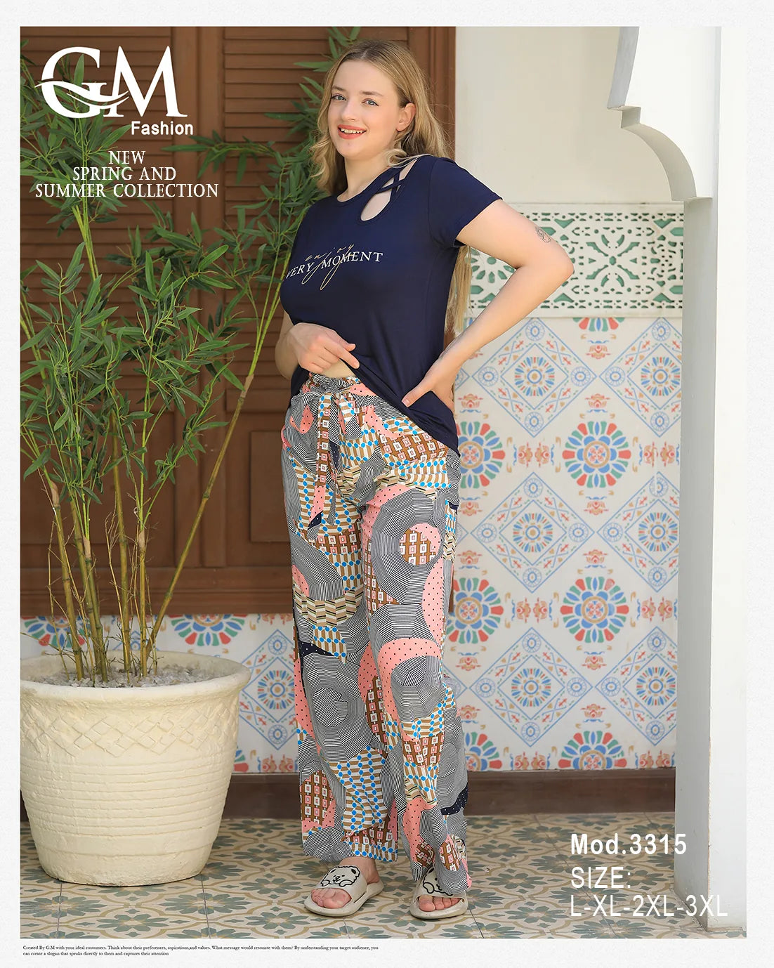 Woman wearing a navy top and patterned pants with 'GM Fashion' branding.