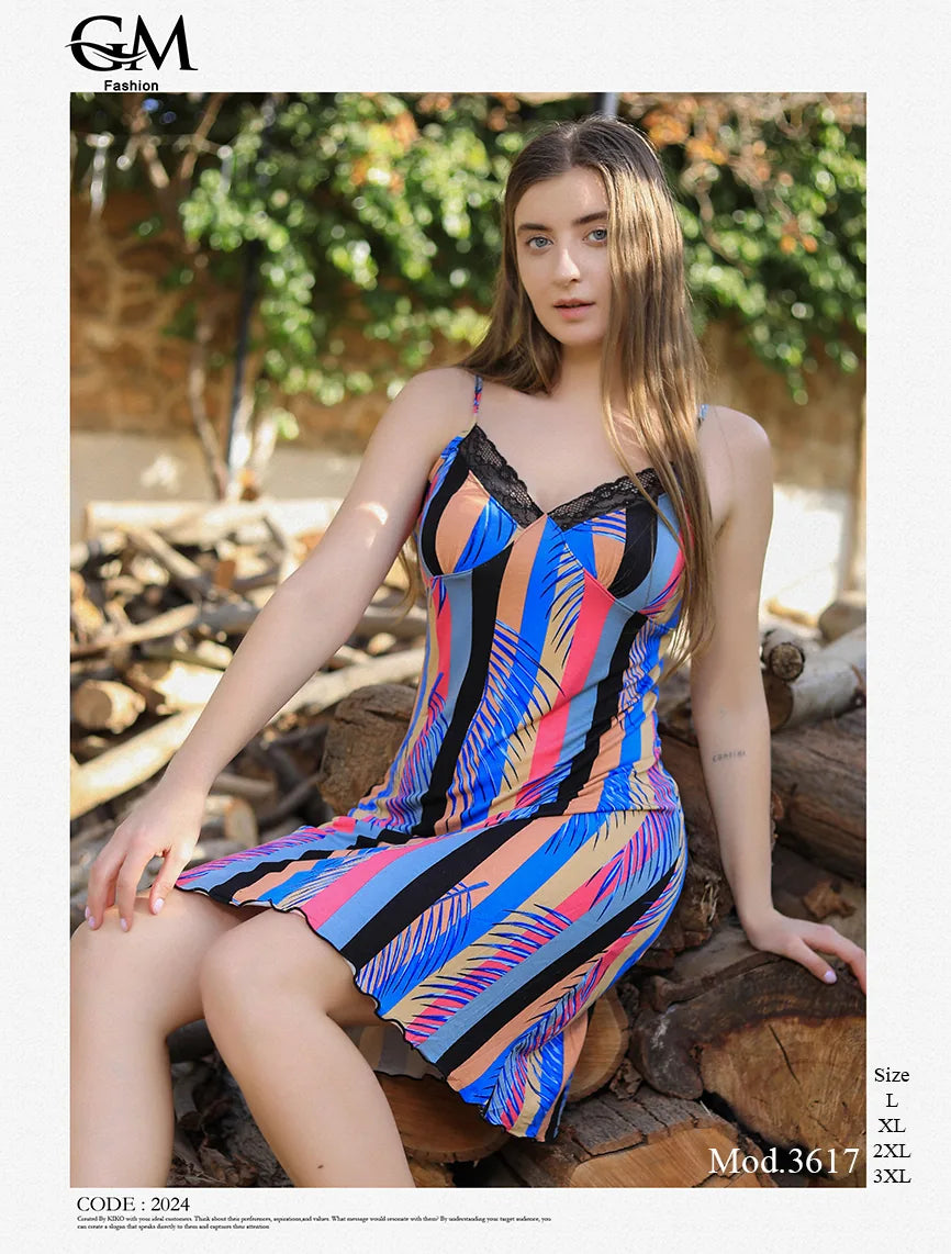 Woman wearing a colorful dress sitting outdoors with 'G&M Fashion' branding.
