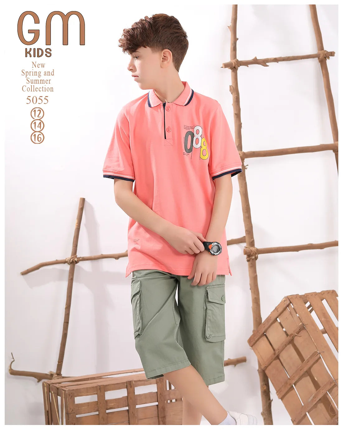 Young boy wearing a pink polo shirt and green shorts standing against a wooden ladder background.