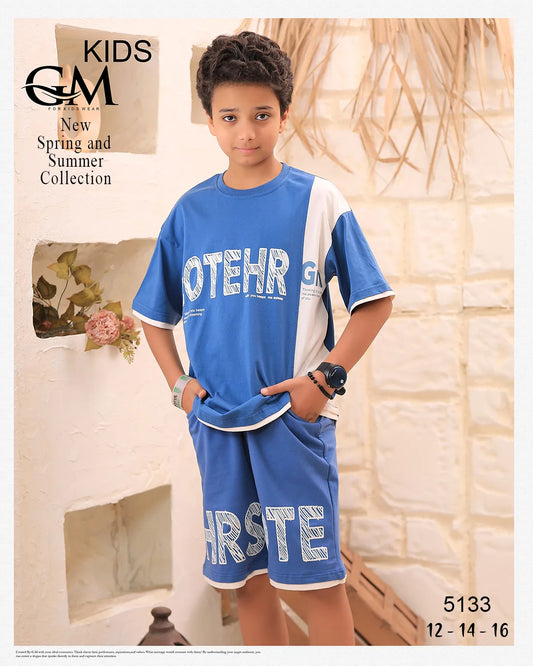 Child wearing a blue and white outfit with visible branding, standing against a neutral background.