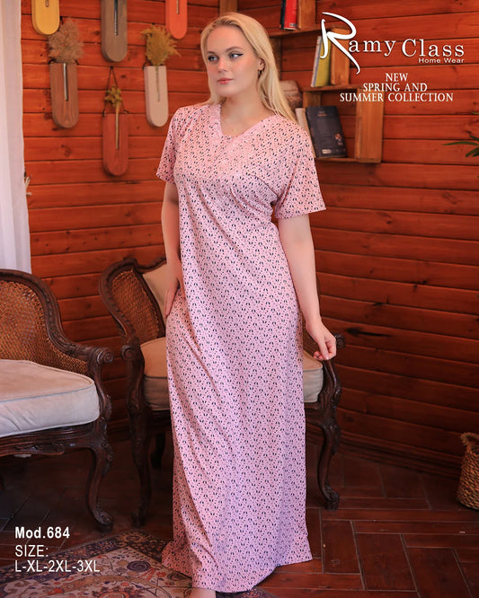 Woman wearing a pink dress with a wooden interior background, featuring 'Ramy Class' branding.