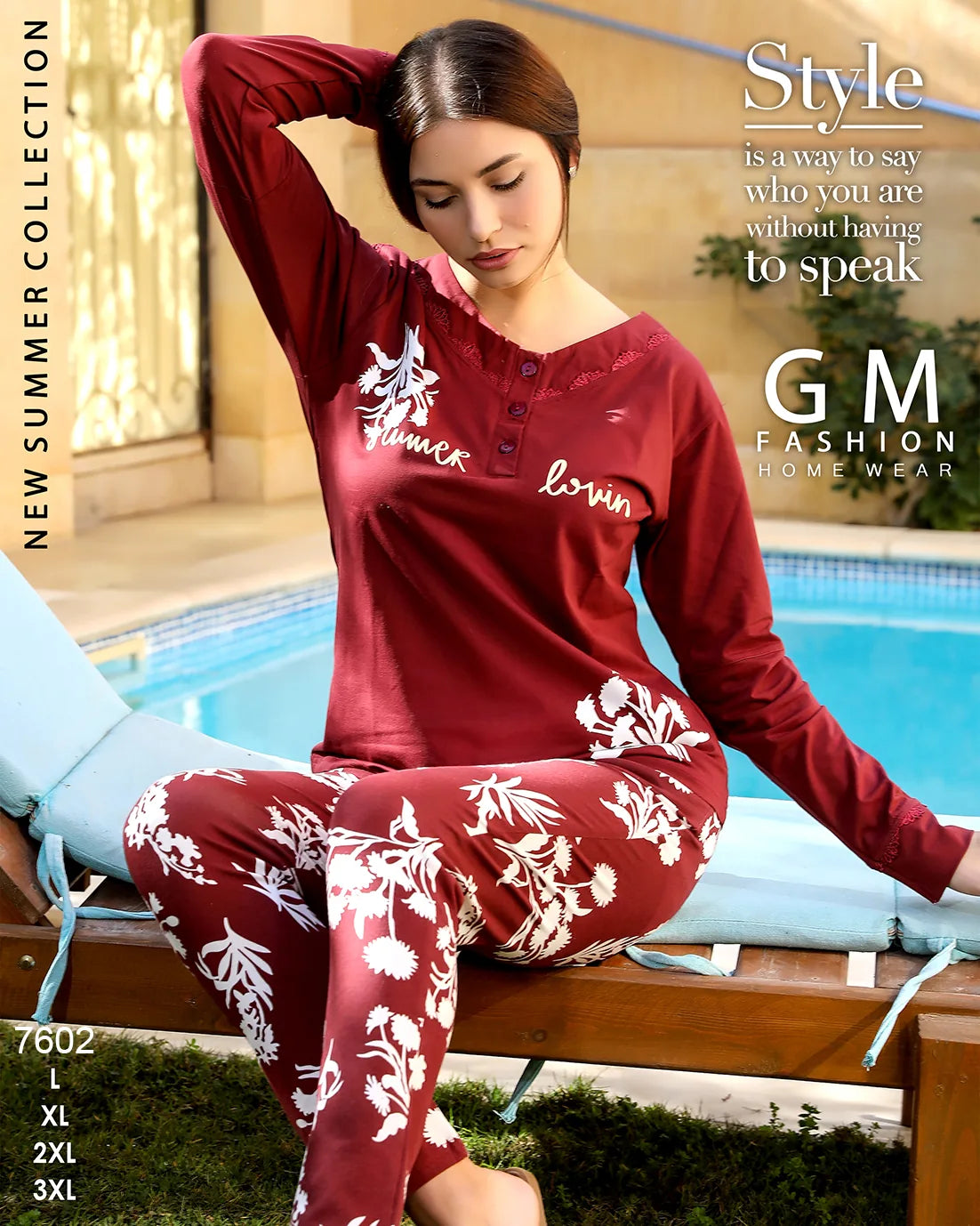 Woman wearing a red and white floral pajama set by GM Fashion by a pool.