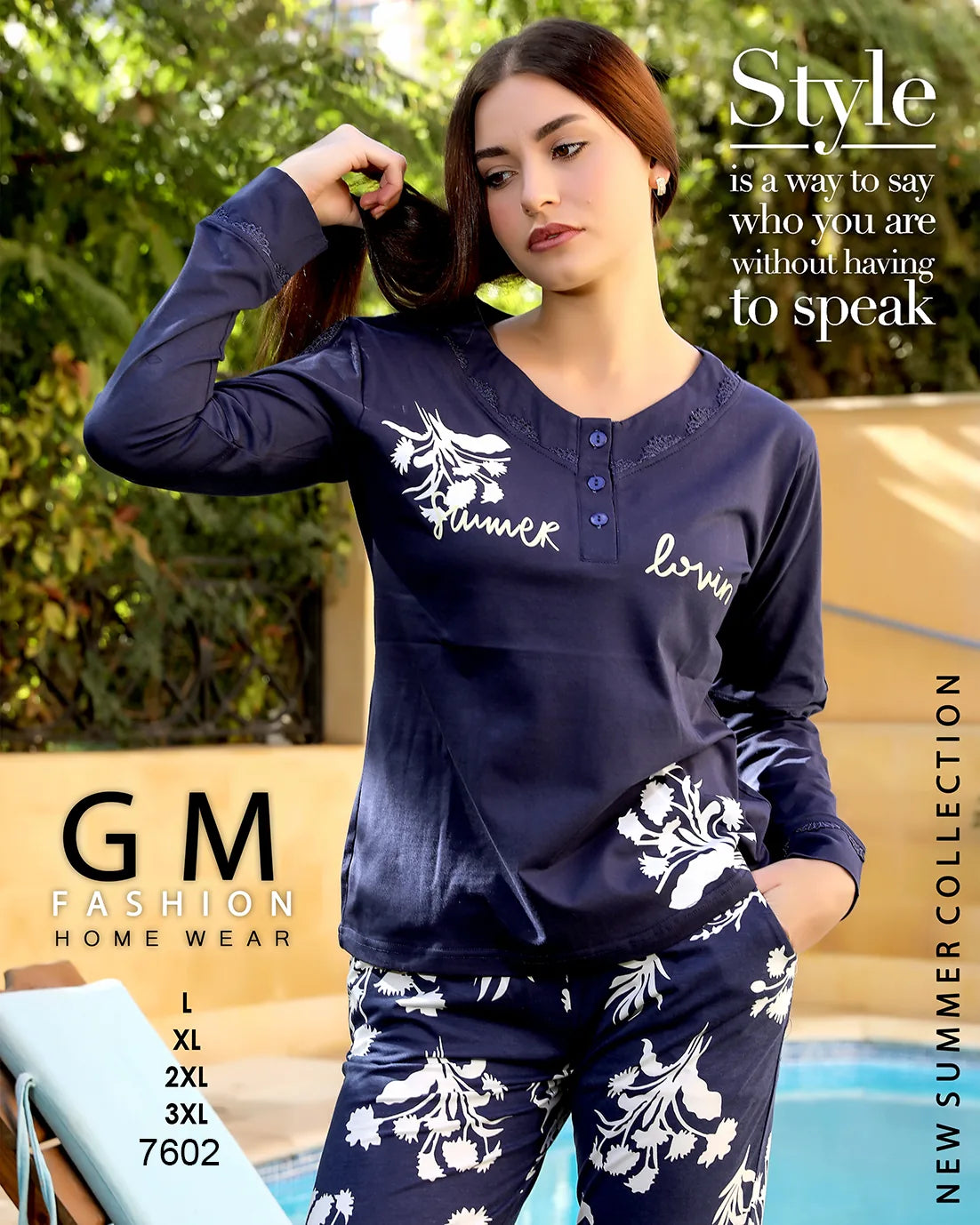 Woman wearing navy blue pajama set with floral patterns by a pool, featuring 'GM Fashion Home Wear' branding.
