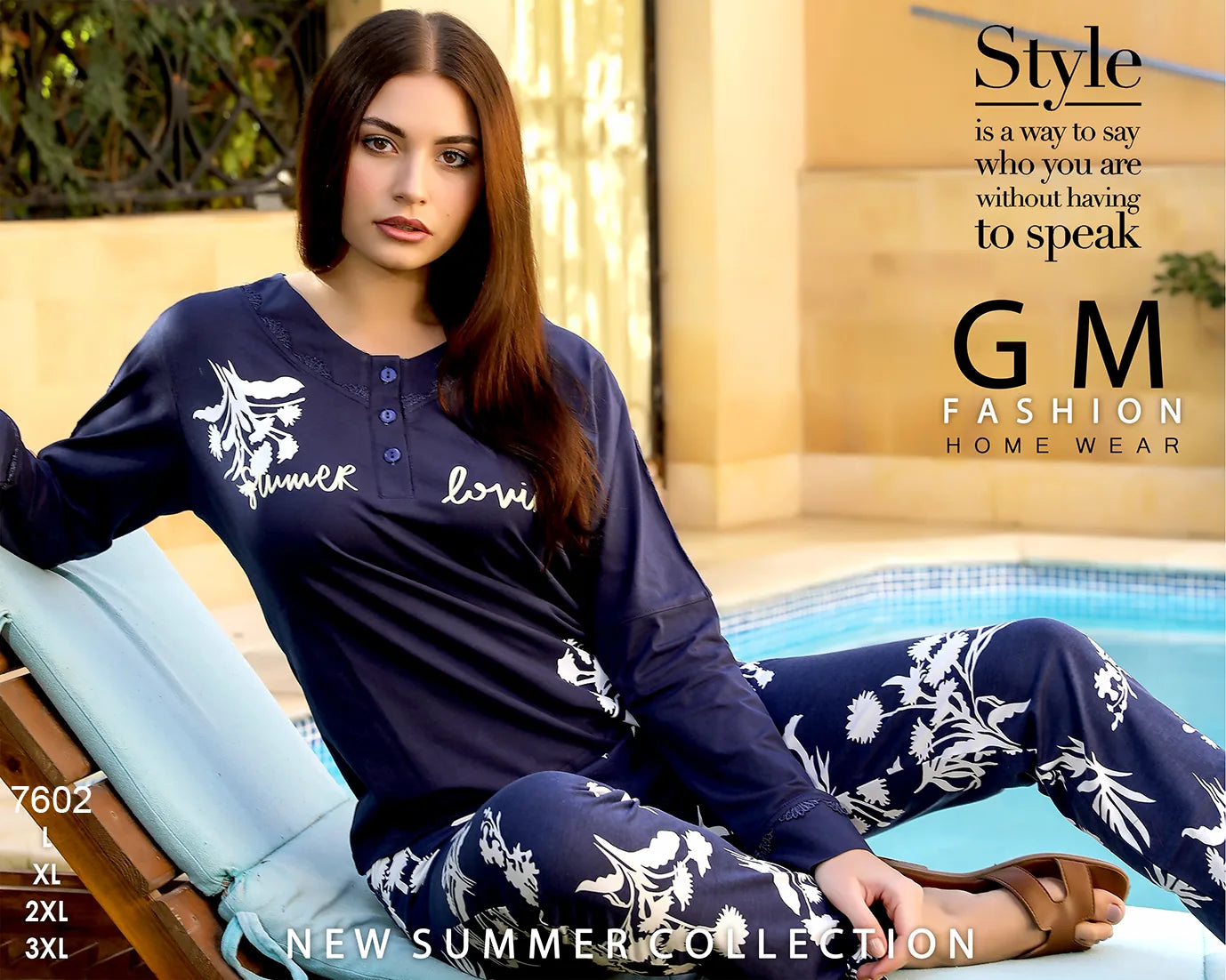 Woman wearing a navy blue outfit with white patterns, sitting by a pool with 'GM Fashion' branding.