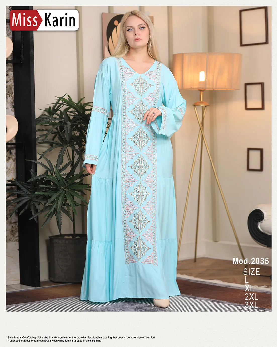 Woman wearing a light blue embroidered dress in a home setting with 'Miss Karin' branding.