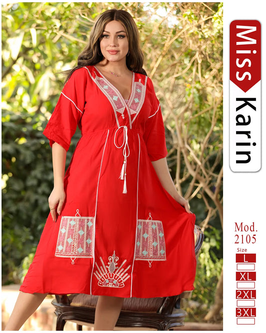 Woman wearing a red dress with white embroidery outdoors, featuring 'Miss Karin' branding.