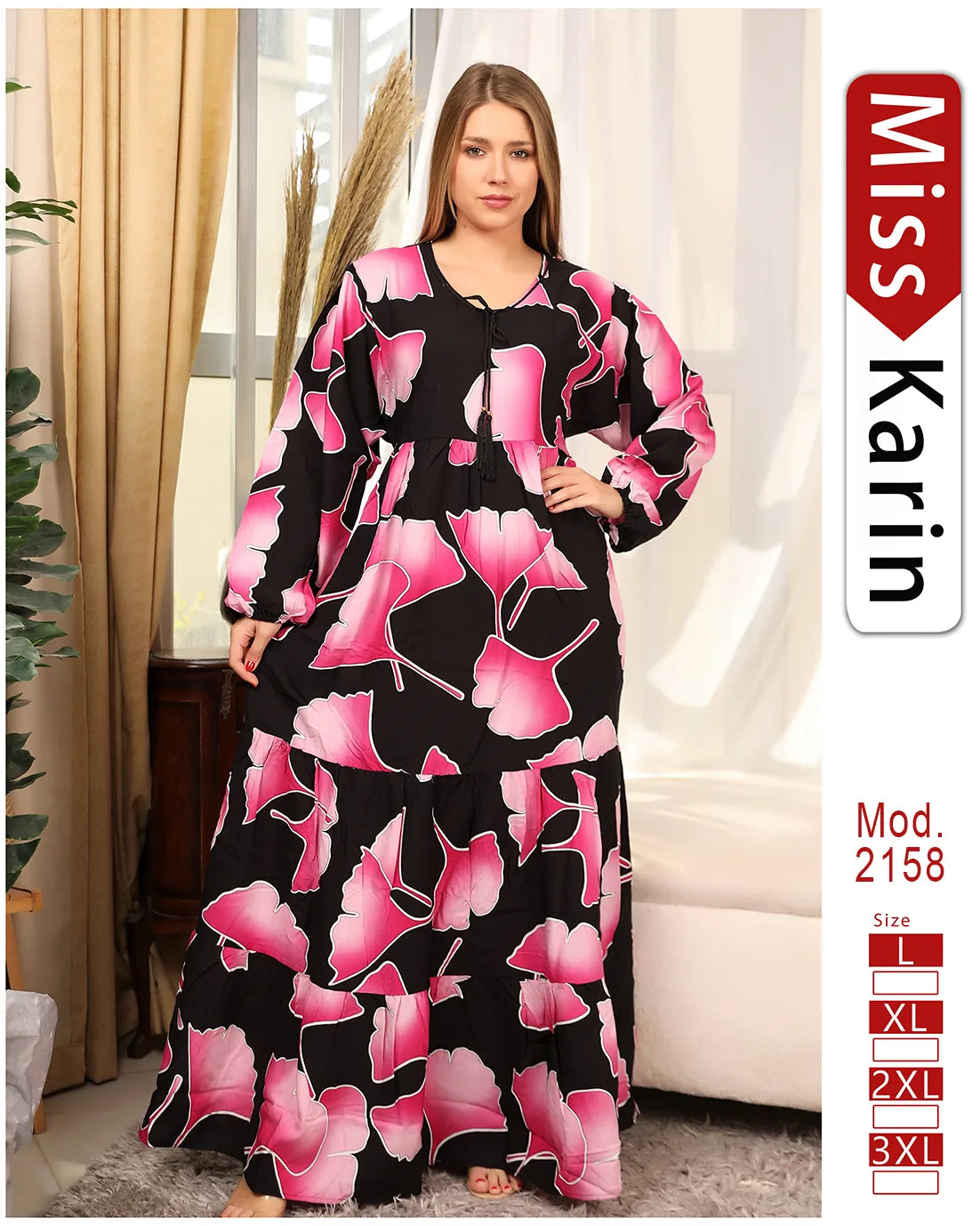 Woman wearing a black and pink floral dress with 'Miss Karin' branding.