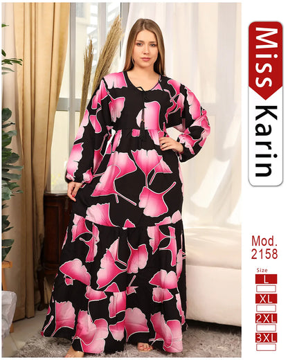 Woman wearing a black and pink floral dress with 'Miss Karin' branding.