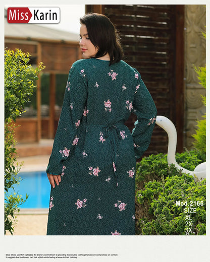 Woman wearing a green floral dress with 'Miss Karin' branding outdoors.