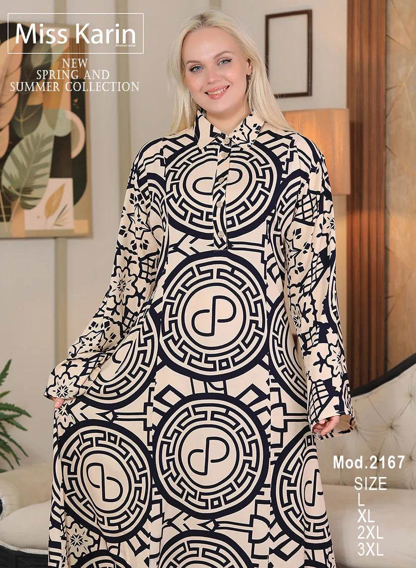 Woman wearing a black and white patterned dress with 'Miss Karin' branding.