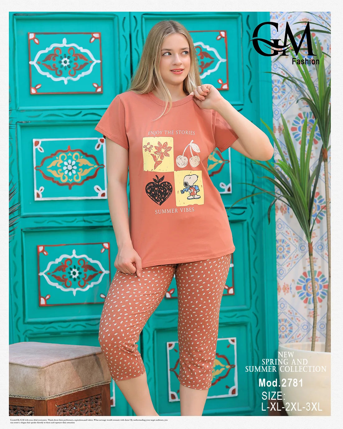 Woman wearing a peach-colored outfit with graphic design in front of a decorative teal wall.