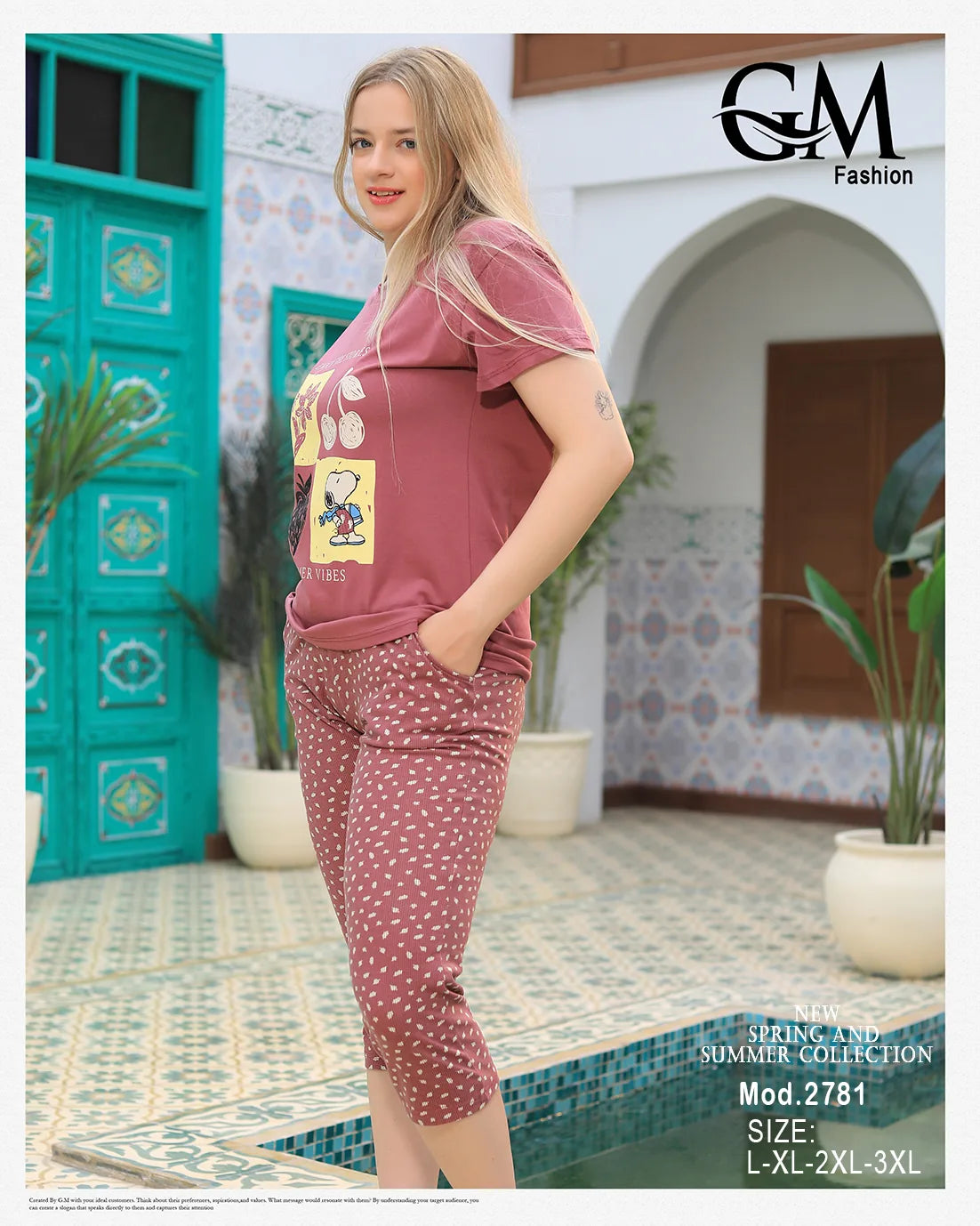 Woman wearing a pink outfit with a graphic design in an outdoor setting, featuring 'GM Fashion'.