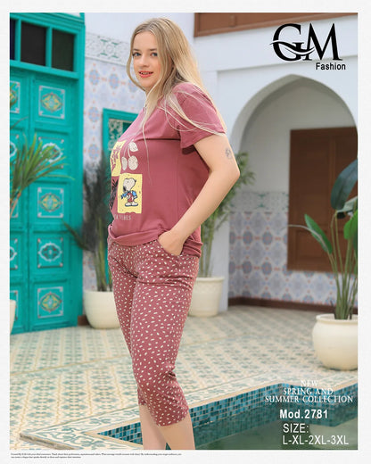 Woman wearing a pink outfit with a graphic design in an outdoor setting, featuring 'GM Fashion'.