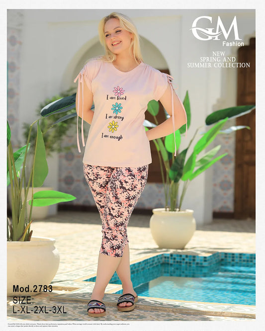 Woman wearing a pink t-shirt and floral leggings by a pool, with 'GM Fashion' branding.
