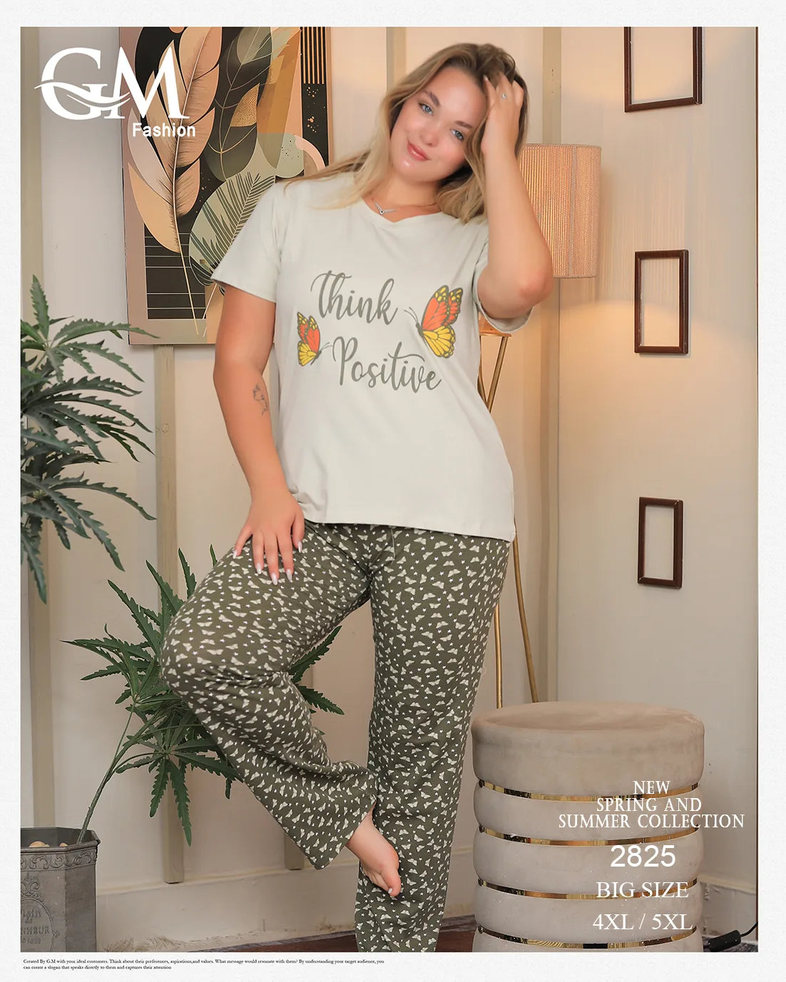 Woman wearing a 'Think Positive' t-shirt and patterned pants in a home setting with decor elements.