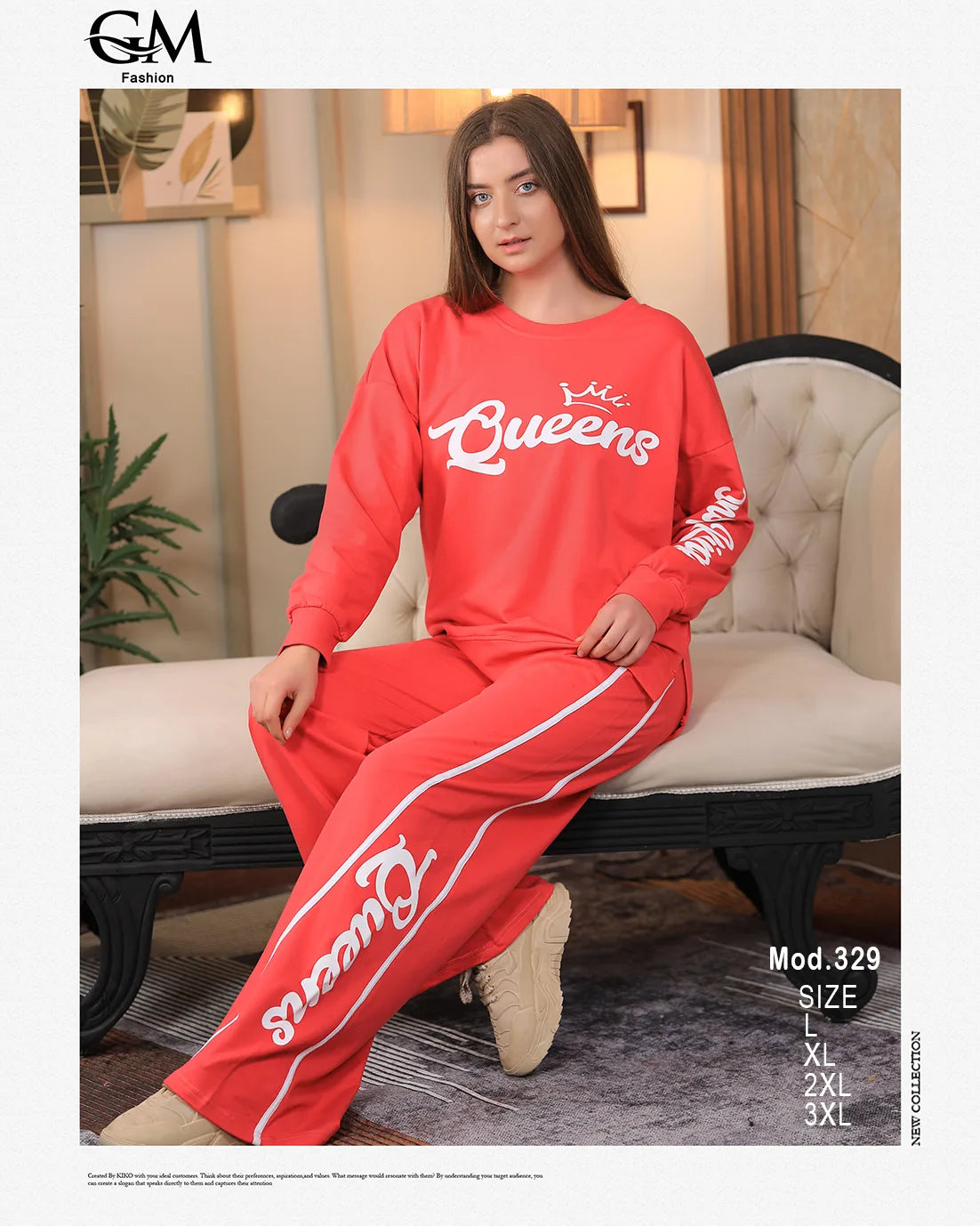 Woman wearing a red 'Queens' tracksuit sitting on a couch in a living room setting.