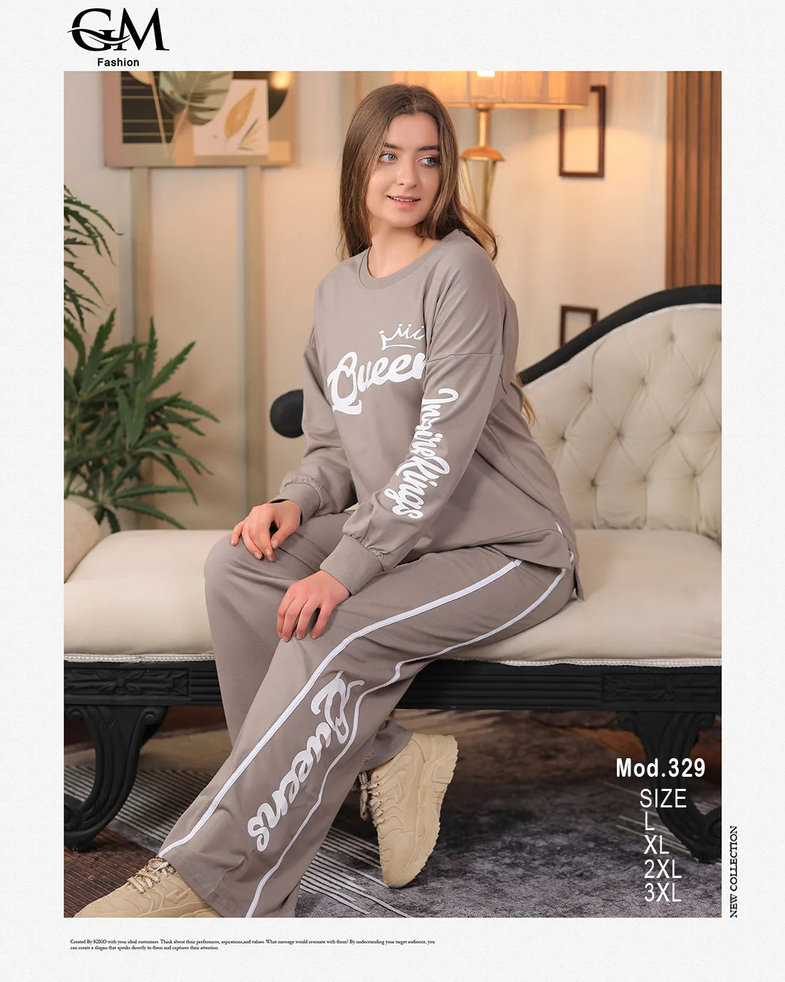 Woman wearing a gray tracksuit with white text sitting on a couch in a living room.