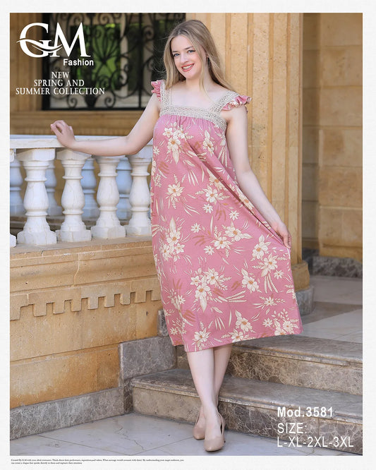 Woman wearing a pink floral dress standing outdoors with 'GM Fashion' branding.