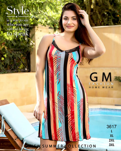 Woman wearing a colorful dress by GM Fashion Home Wear by a poolside.