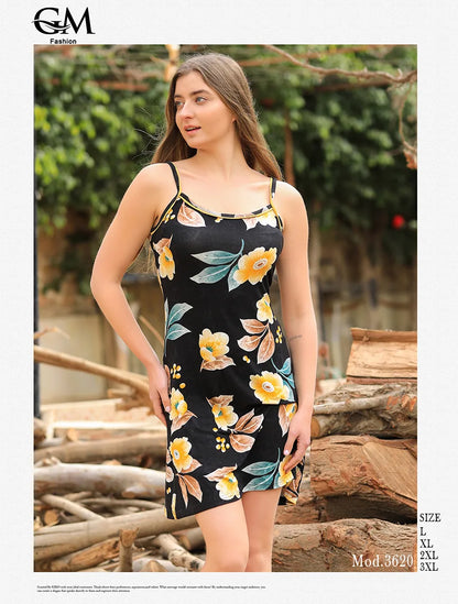 Woman wearing a floral dress with G&M Fashion branding in an outdoor setting.