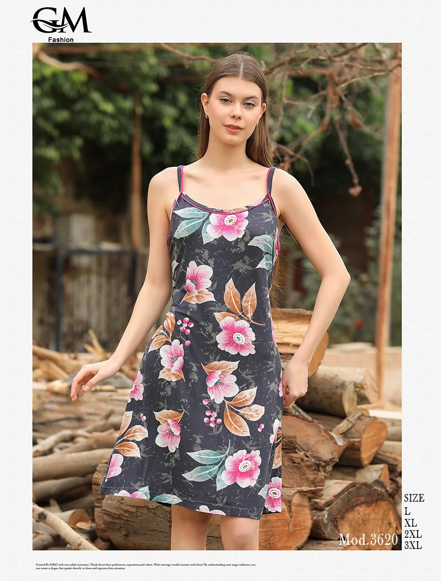 Woman wearing a floral dress standing in front of stacked logs with 'G&G Fashion' branding.