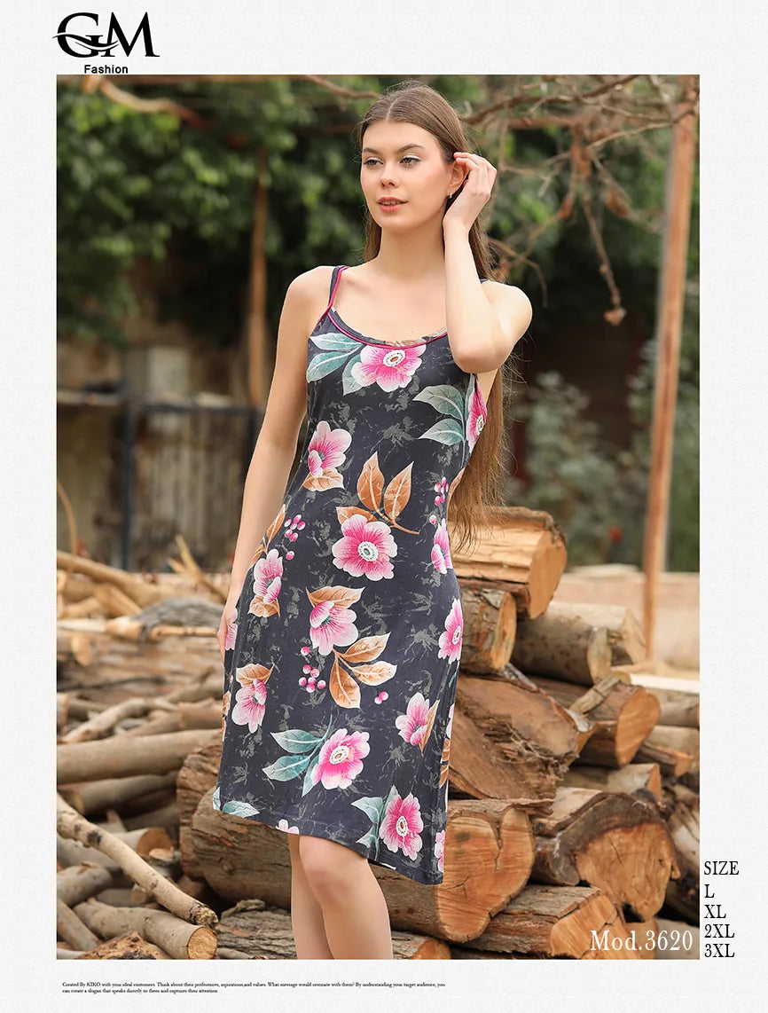 Woman wearing a floral dress standing in front of stacked logs with 'G&M Fashion' branding.