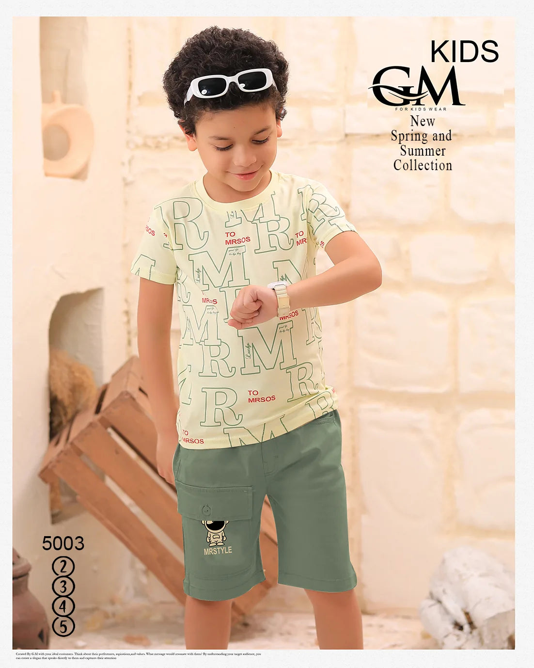 Child wearing a light-colored shirt with text and green shorts indoors, with 'GM' branding.
