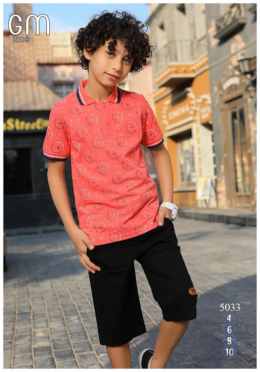 Child wearing a red polo shirt with black shorts on a street background