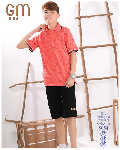 Child wearing a red patterned shirt and black shorts with 'GM Kids' branding.