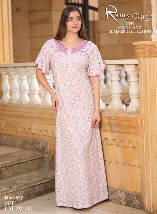 Woman wearing a floral dress standing on stone steps with 'Ramy Class' branding.