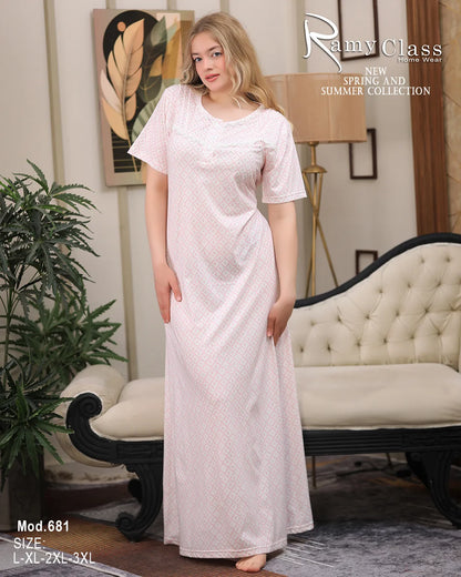 Woman wearing a long white dress in a room with decor elements.